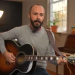An instructor playing an acoustic guitar.